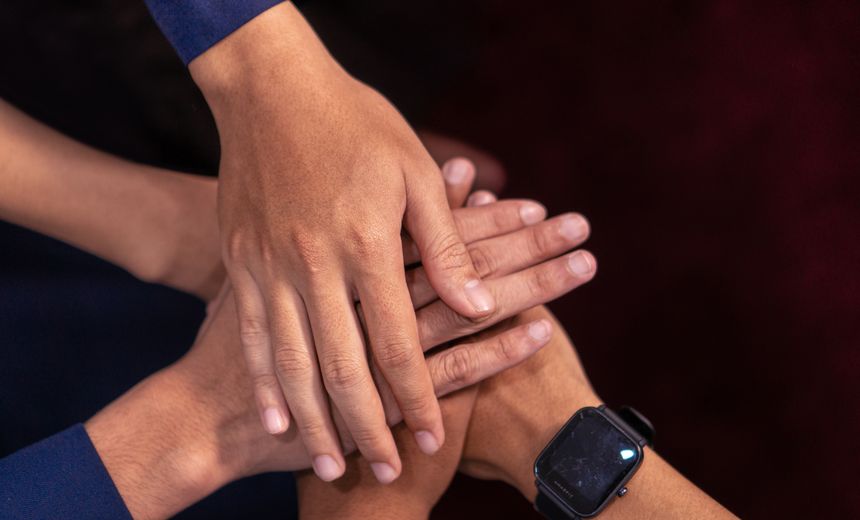 People joining hands in support of their community